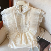 Ruffled-Bib Sleeveless Blouse
